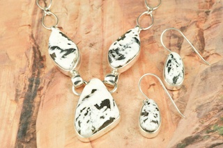 Genuine White Buffalo Turquoise set in Sterling Silver. This Beautiful Stone is formed from the minerals Calcite and Iron. It is mined near Tonopah Nevada. Stunning Necklace and Earrings Set.  Created by Navajo Artist Tony Garcia. Signed by the artist.  